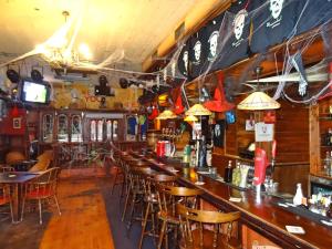 a bar with wooden tables and chairs in a room at Apartment Orihuela Costa Golf 650 in Los Dolses