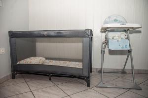 a small black bunk bed with a table in a room at Villa Paolija in Novigrad Istria