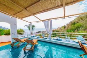 a villa with a swimming pool with a view at Eden House Positano in Positano