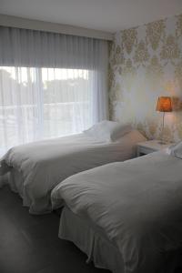 Cama ou camas em um quarto em Yoo Punta del Este - Rental Club Apartments