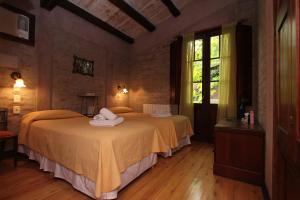 Cama ou camas em um quarto em Casa Glebinias