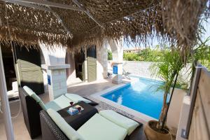 a villa with a swimming pool and a resort at Villa Christy in Stalos
