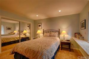 a bedroom with two beds and a large mirror at Suite Sunshine in Yosemite West