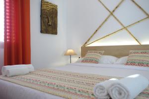 Postel nebo postele na pokoji v ubytování MAGMA Rooms Playa Honda + 37 fotografií