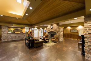 a lobby of a hospital with a stone fireplace at Bridges Bay Resort in Arnolds Park