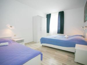 Posteľ alebo postele v izbe v ubytovaní Sesar Apartments Krk - No. 3 Cvita
