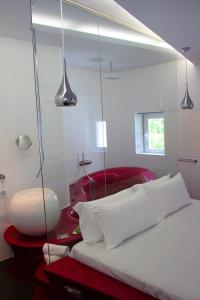Postel nebo postele na pokoji v ubytování Absoluto Design Hotel