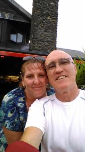 a man and a woman posing for a picture at Paradise In Whitianga B & B in Whitianga