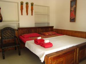 Postel nebo postele na pokoji v ubytování Atithi Guest House Pushkar