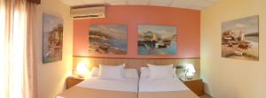 Postel nebo postele na pokoji v ubytování Hotel Pinomar