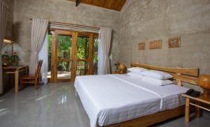 a bedroom with a bed and a desk and a window at Valley Village Resort Phu Quoc in Phú Quốc +120 photos