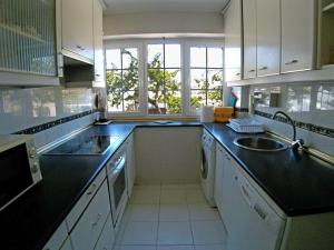 a kitchen with a sink and a counter top at Casa Bellavista in Segovia