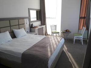 Postel nebo postele na pokoji v ubytování Hotel Green Glass