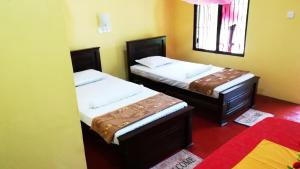Postel nebo postele na pokoji v ubytování Araliya land Resort Dambulla + 20 fotografií