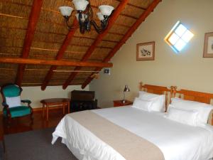 Tempat tidur dalam kamar di Karoo-Rust