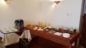 a table with a buffet of food on it at La Casona Monsante in Chachapoyas
