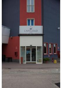 a building with a sign on the front of it at L'Angolo in Carisio