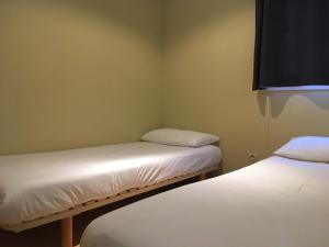 Cama o camas de una habitación en Camping La Fundicion