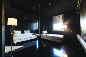 Ein Bett oder Betten in einem Zimmer der Unterkunft Aiden by Best Western JHD Dunant Hotel