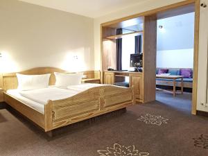 Postel nebo postele na pokoji v ubytování Hotel in den Herrnwiesen