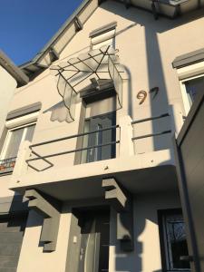 a building with a balcony on the side of it at ALBI HOME - Rochegude in Albi