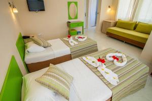 A bed or beds in a room at Hotel Dream Of Side