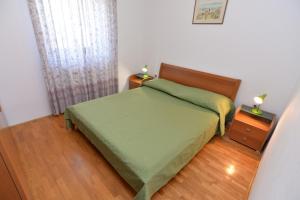 Postel nebo postele na pokoji v ubytování Apartments Slavica 590