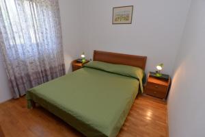 Postel nebo postele na pokoji v ubytování Apartments Slavica 590