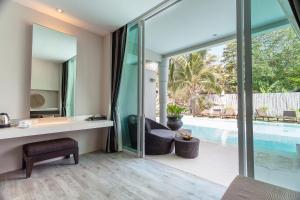 a home office with a view of a swimming pool at Sarikantang Resort & Spa, Koh Phangan in Haad Rin