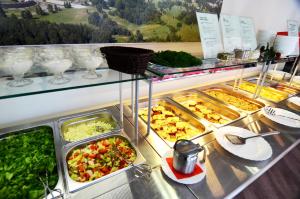 a buffet line with many different types of food at Tehvandi Hotell in Otepää