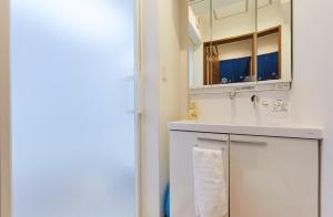 Ett badrum på Haneda Luxury House