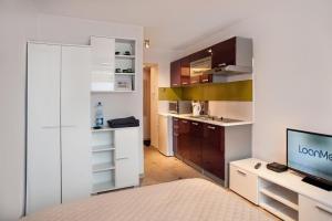 Kuchyň nebo kuchyňský kout v ubytování Apartament SYNERGIA
