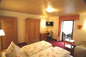 Postel nebo postele na pokoji v ubytování Alpenchalet Bianca