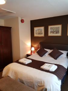 Letto o letti in una camera di Old George Hotel