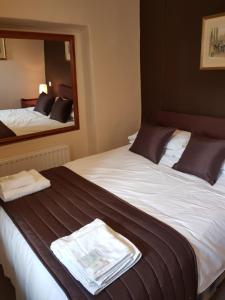 Letto o letti in una camera di Old George Hotel