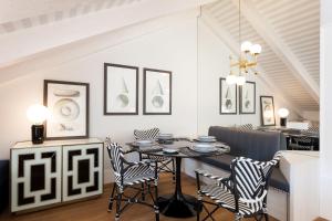 a dining room with a table and chairs at FLH Restauradores Amazing Flat with View in Lisbon