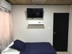Voodi või voodid majutusasutuse Caribbean Island Hotel toas