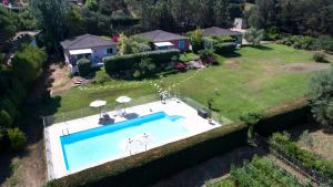 an aerial view of a house with a swimming pool at Villas les Residences de Scaglione in Porticcio