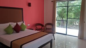 Postel nebo postele na pokoji v ubytování Organic Garden Resort Sigiriya