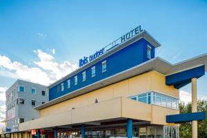 a building with a blue and yellow at Ibis Budget Salzburg Airport - Contactless Check-In in Salzburg