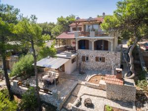 an aerial view of a house with a yard at Pavao Apartments in Vrboska