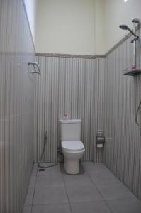 a bathroom with a toilet and a shower at Deva Devi Beach Inn Luxury in Nusa Penida +43 photos