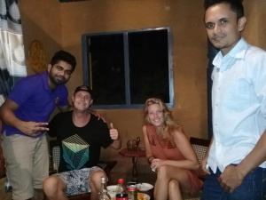 a group of people posing for a picture in a room at Ancient Gardens - Villa in Pinnawala