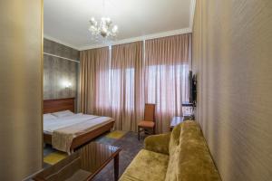 
Кровать или кровати в номере Погости на Ленинградском проспекте
