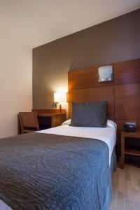 Postel nebo postele na pokoji v ubytování Hotel Via Augusta