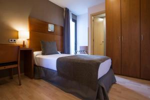Postel nebo postele na pokoji v ubytování Hotel Via Augusta