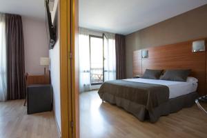 Postel nebo postele na pokoji v ubytování Hotel Via Augusta