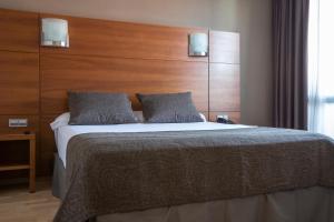 Postel nebo postele na pokoji v ubytování Hotel Via Augusta