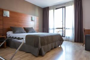 Postel nebo postele na pokoji v ubytování Hotel Via Augusta