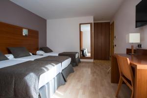 Postel nebo postele na pokoji v ubytování Hotel Via Augusta